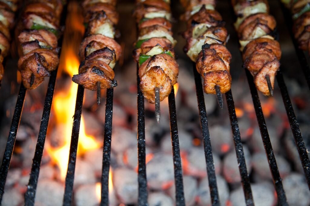 kebab with veggies being cooked